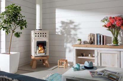 The living room with log burner at Woolf, Cornwall