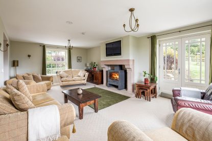 The living room with a log-burning stove at Tinkers Folly, Yorkshire