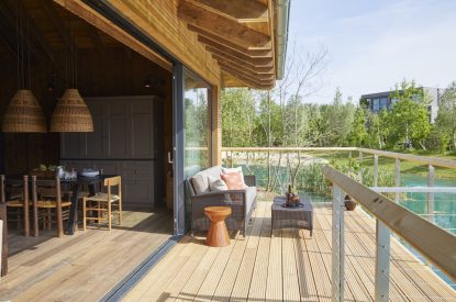 The balcony with lake view at Lakeside Cabin, Cotswolds