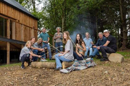 A family sitting around the fire pit at Ermine, Scotland