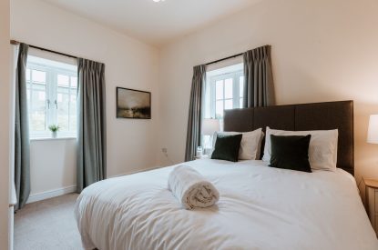A king size bedroom at The Equestrians, Shropshire