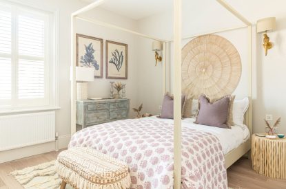 A four poster bedroom at Coral House, Dorset