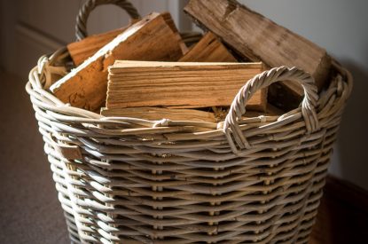 A log basket at Hawthorn Farmhouse, Somerset