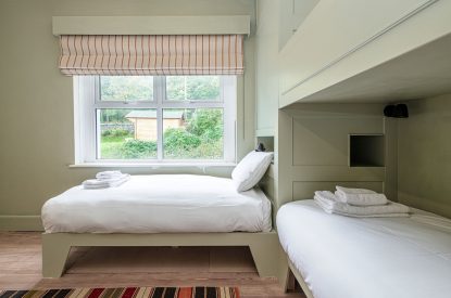 A bunk bedroom  at Plas Glan Menai, Anglesey