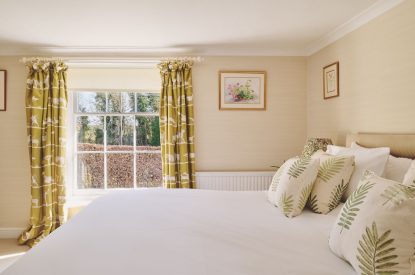 A super king sized bedroom at Hockham House, Norfolk Coast