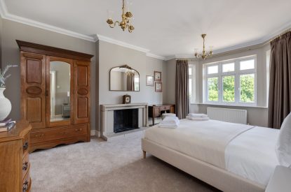 A king sized bedroom at Merry Manor, Essex