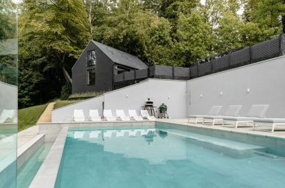 The swimming pool terrace at Halo House, Cotswolds