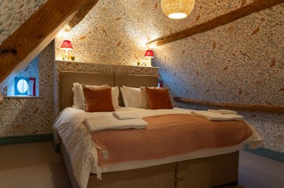 A super-king size bedroom at Parkview Farmhouse, Somerset
