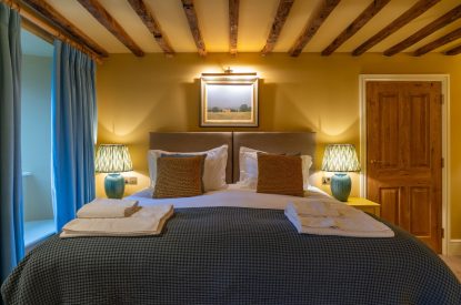 A super-king size bedroom at Parkview Farmhouse, Somerset