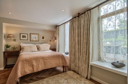 A king-size bedroom at Olive Orchard, Cotswolds