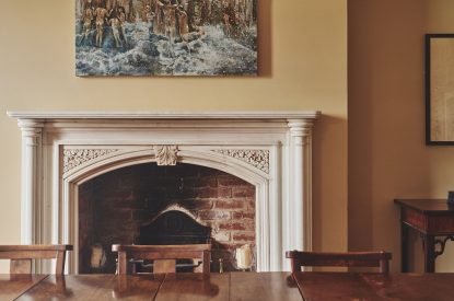 The open fire in the dining room at Heron House, Peak District
