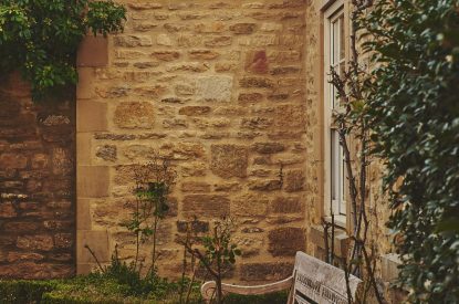 A bench in the garden at Tennyson House, Cotswolds