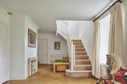 The hallway and stairs at Tennyson House, Cotswolds