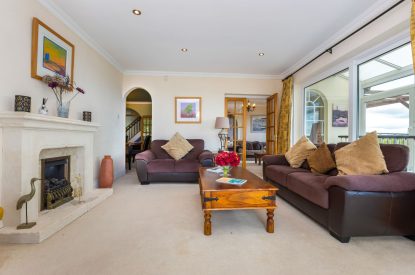 The living room with log burner at Seahaven, Devon