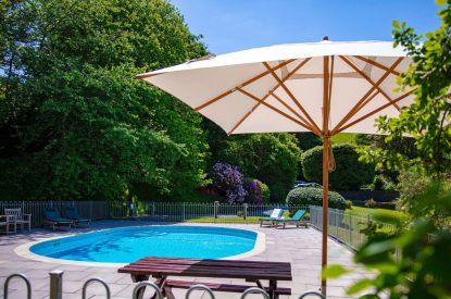 The outdoor swimming pool at Fern House, Devon