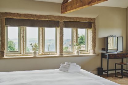 A king size bedroom at Rye Top Farm, Uppermill, Peak District