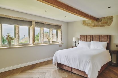 A king size bedroom at Rye Top Farm, Uppermill, Peak District