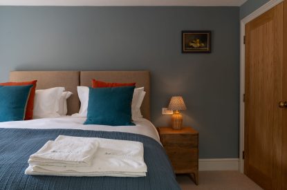 A super king sized bedroom at Poppy Cottage, Somerset