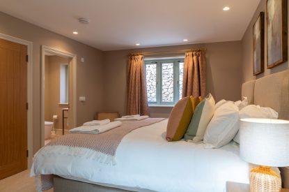 A super king sized bedroom at Poppy Cottage, Somerset