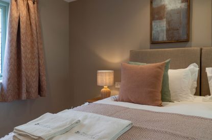 A super king sized bedroom at Poppy Cottage, Somerset