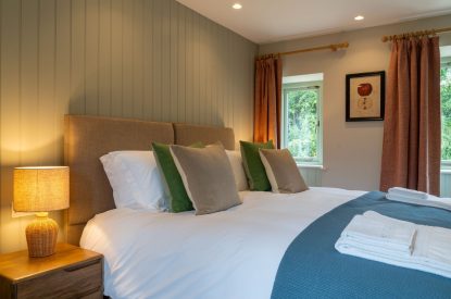 A super king sized bedroom at Poppy Cottage, Somerset