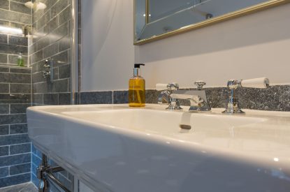 An en-suite bathroom at The Thatched Cottage, Somerset