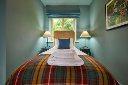 A twin bedroom at Mawson Hall, Lake District