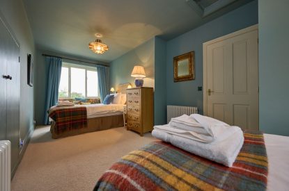 A twin bedroom at Mawson Hall, Lake District