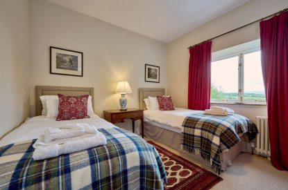 A twin bedroom at Mawson Hall, Lake District