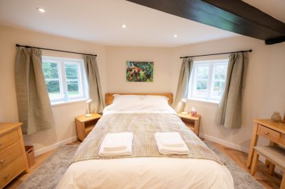 A king-size bedroom at Grimsbury Castle, Berkshire