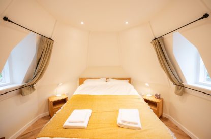 The king-size bedroom at Grimsbury Castle, Berkshire
