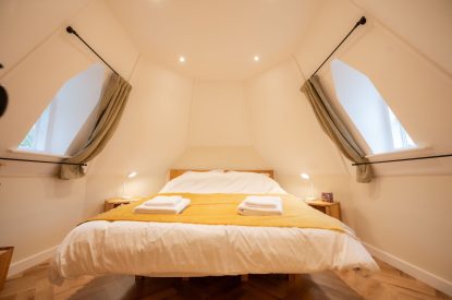 The super king-size bedroom at Grimsbury Castle, Berkshire