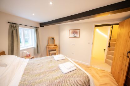 A king-size bedroom at Grimsbury Castle, Berkshire