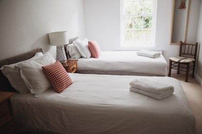 A twin bedroom at The Coachman's House, Wiltshire