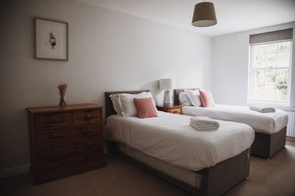 A twin bedroom at The Coachman's House, Wiltshire