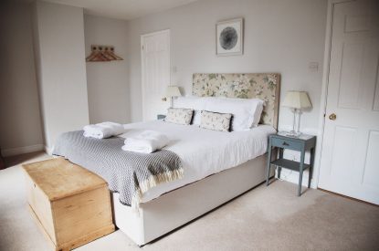 A king-size bedroom at The Coachman's House, Wiltshire