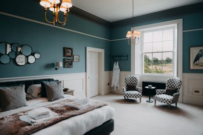 A king-size bedroom at Stoke Hall, Nottinghamshire