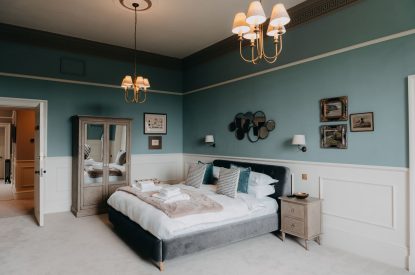 A king-size bedroom at Stoke Hall, Nottinghamshire