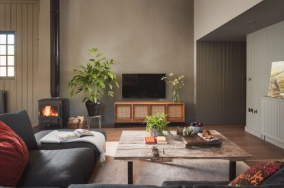 The living room with log burner at Exe Valley Barn, Devon