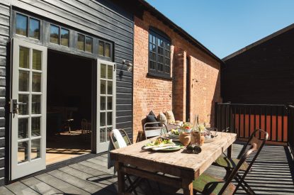 The outdoor dining area at Exe Valley Barn, Devon
