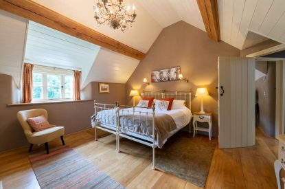 A king-size bedroom at Butterfly Cottage, Somerset