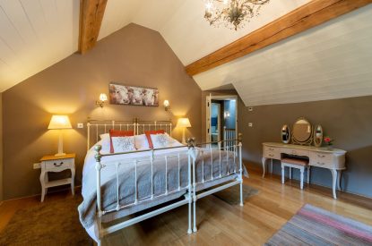 A king-size bedroom at Butterfly Cottage, Somerset