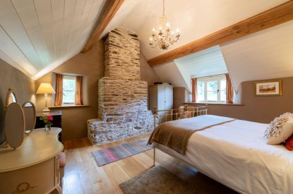 A king-size bedroom at Butterfly Cottage, Somerset