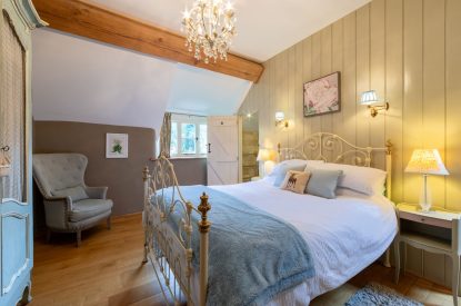 A king-size bedroom at Butterfly Cottage, Somerset