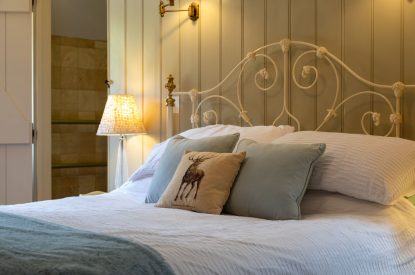 A king-size bedroom at Butterfly Cottage, Somerset