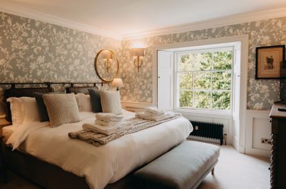 A king-size bedroom at Stoke Hall, Nottinghamshire
