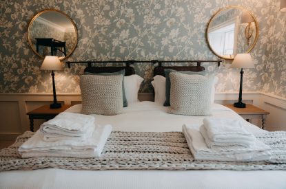 A king-size bedroom at Stoke Hall, Nottinghamshire