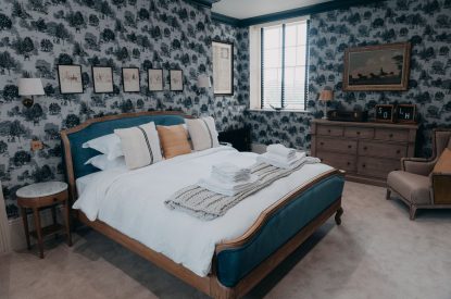 A king-size bedroom at Stoke Hall, Nottinghamshire
