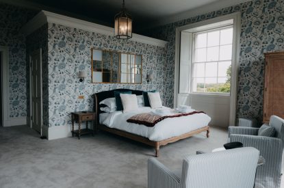 A king-size bedroom at Stoke Hall, Nottinghamshire