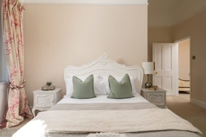 A king-size bedroom at The Victorian Manor, Dorset